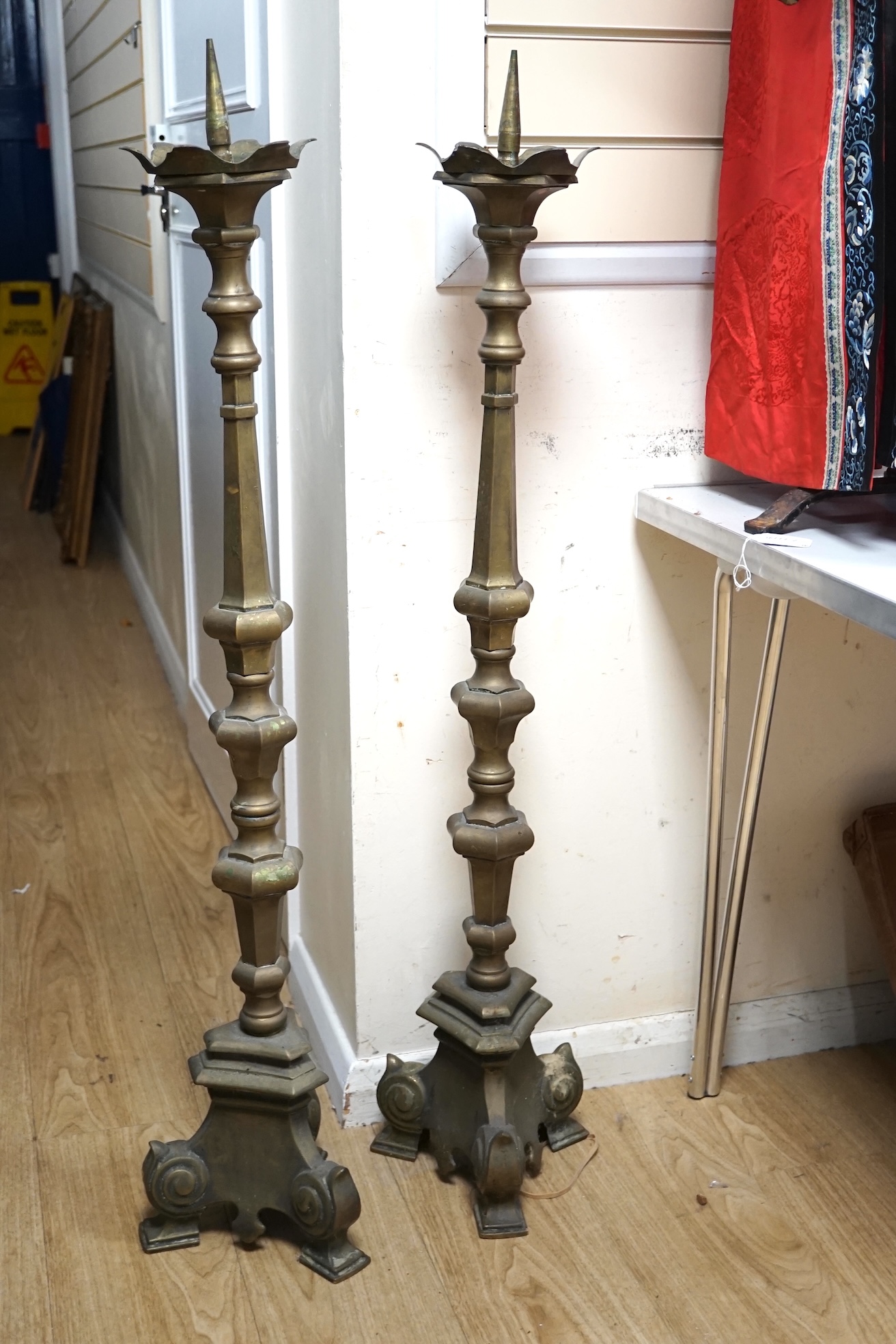 A pair of large Dutch altar brass candle sticks, 113cm high. Condition - fair to good